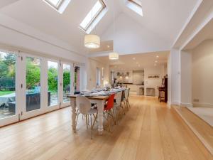 a kitchen and dining room with a table and chairs at Tall Trees in Whitstable