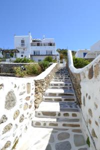 a stone path leading up to a building at Anchor Αpartments in Mýkonos City
