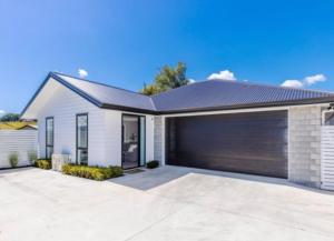 a rendering of a house with a garage at Bhujen Homestay in Te Awamutu