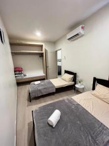 Ένα ή περισσότερα κρεβάτια σε δωμάτιο στο Gtr Staycation 2