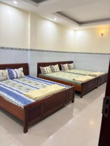 Ένα ή περισσότερα κρεβάτια σε δωμάτιο στο Motel Liên Anh