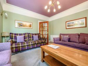 a living room with two couches and a coffee table at Greenbank in Keswick