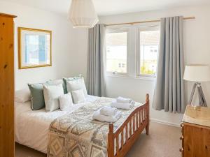 En eller flere senge i et værelse på Sandy View