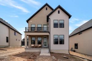 a large house with a balcony on top of it at Hygge Ridge - Valley East Village in Heber City