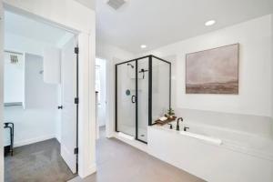a white bathroom with a shower and a sink at Hygge Ridge - Valley East Village in Heber City +17 photos
