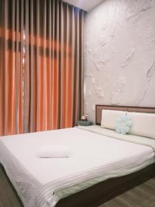 Ένα ή περισσότερα κρεβάτια σε δωμάτιο στο Bơ House- Đảo Phú Quý