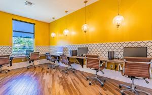 a room with a row of desks and chairs at Landing Fort Myers near Heritage Palms in Fort Myers +45 photos
