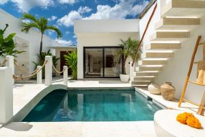 a swimming pool in the backyard of a villa at Villa Romance in Tumbak Bayuh
