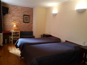 Postel nebo postele na pokoji v ubytování Hotel La Barakka