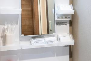 a bathroom with white shelves and a mirror at Amp Flat Arc Bliss 4 in Chikushino +38 photos