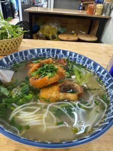 a bowl of soup with shrimp and vegetables in it at Biển Xanh 303DM in Hanoi