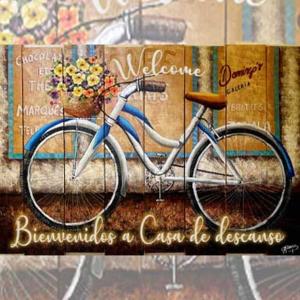 a painting of a bicycle with a basket of flowers at Departamento Familiar in Tehuacán