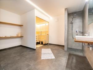 a bathroom with a sink and a shower at Chalet in Bad Hofgastein near Ski Slopes in Bad Hofgastein