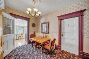 a dining room with a table and chairs at Marmora and Lake Inn Honeymoon Suite in Marmora