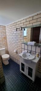 a bathroom with a sink and a toilet at Beach Front Bliss - Luxurious 3 Bedroom Beachfront Apartment in Maroochydore in Maroochydore +24 photos