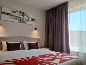 Postel nebo postele na pokoji v ubytování KURPIAI Apartments