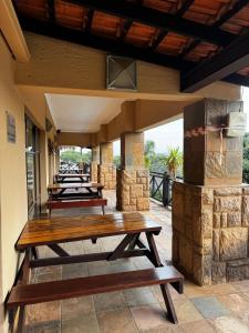 a group of picnic tables on a patio at Ocean View Villas F05 in Port Edward