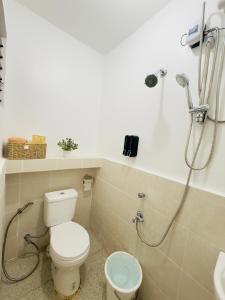 a bathroom with a toilet and a shower at Casa Realiyx in Ra-as +10 photos