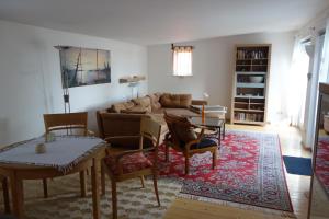 a living room with a couch and a table at Ferienhaus in Waren an der Müritz in Waren