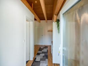 a hallway with a glass door and a rug at Riverside Stay in Sudwinsen in Winsen Aller +30 photos