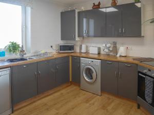 Køkken eller tekøkken på Lloyds Cottage