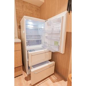 an empty refrigerator with its door open in a kitchen at Mi-HOTEL SUGAMO in Tokyo +183 photos
