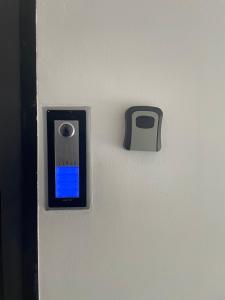 a door with a cell phone sticking out of it at Mirno in elegantno stanovanje - Parkirišče, Netflix, wifi in Maribor