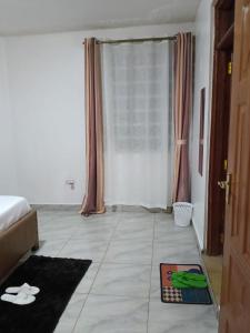 Postel nebo postele na pokoji v ubytování Eldoret Cozy 2-Bed Along Kisumu Road Near Maya