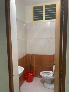 a bathroom with a toilet and a sink at Entire 2BHK Apartment in TNagar Chennai in Chennai