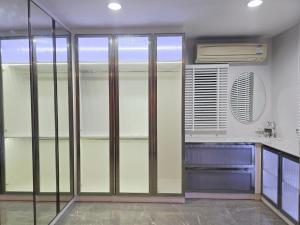 a kitchen with glass sliding doors in a room at Elegant 3 Bedrooms Home near MRT Central WestGate and Central WestVille 3 to 10 Min Drive 