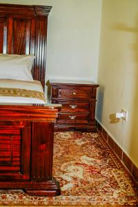 Postel nebo postele na pokoji v ubytování Luxore Rozina Airport view Apartments, Syokimau