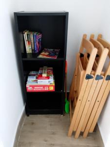 a book shelf with a bunch of baseball bats at Almarisa - appartamento vista mare in Salerno