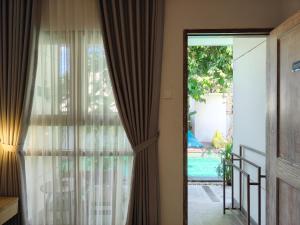 Ένα ή περισσότερα κρεβάτια σε δωμάτιο στο Manuver Surf And Stay Uluwatu Bali +21 φωτογραφίες