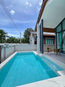 an image of a swimming pool in a house at Emmaree Villa in Ban Chong Phli