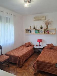 Postel nebo postele na pokoji v ubytování Holiday home Bokokotorski zaliv