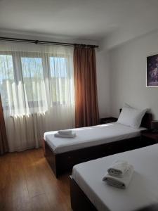 Postel nebo postele na pokoji v ubytování Hotel Dacor