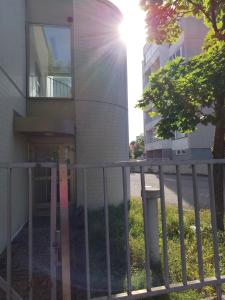 a building with a fence in front of it at Kouvolankatu Studio in Kouvola