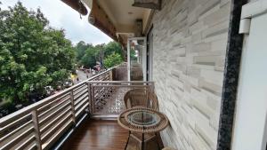 a balcony with a bench and a wall at Park View in Varanasi