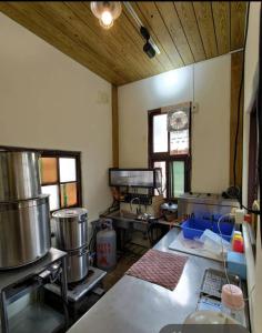 a kitchen with some pots and pans in a room at Anping Sucess BnB in Tainan +116 photos
