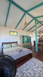 Ένα ή περισσότερα κρεβάτια σε δωμάτιο στο La Bima Beach House