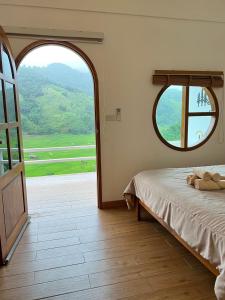 Postel nebo postele na pokoji v ubytování นาลั๊วะ-บ้านเวร Nalua-Banwen + 41 fotografií