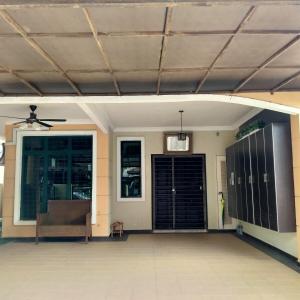 a patio with a couch and a ceiling at 4-room double storey house, 10km KLIA in Sepang +12 photos