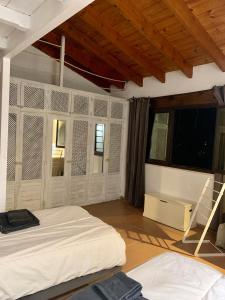 a bedroom with two beds and a window at Studio by the sea in Santa Ponsa
