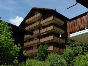 a building with balconies on the side of it at Family Stay in Aletsch Alps in Bellwald