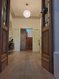 a hallway with a door open to a room at Villa Emilia nelle Dolomiti in Domegge di Cadore