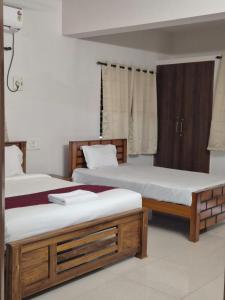 Postel nebo postele na pokoji v ubytování Rivera Nest Serviced Apartment