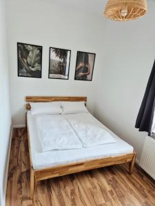 Ένα ή περισσότερα κρεβάτια σε δωμάτιο στο 2-Zimmer Wohnung 4 - Apartments am Schloss