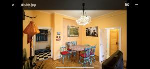 a dining room with a table and chairs at Best Location cosy Art flat in Budapest