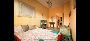 a bedroom with a bed and a painting on the wall at Best Location cosy Art flat in Budapest +3 photos