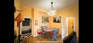 a dining room with a table and chairs at Best Location cosy Art flat in Budapest